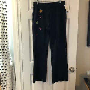 Dark wash denim pants with embroidered butterflies